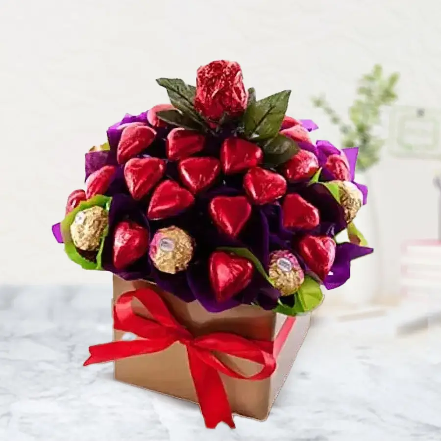 A beautifully arranged box containing 22 heart-shaped handmade chocolates and 8 Ferrero Rocher chocolates, perfect for gifting on special occasions.