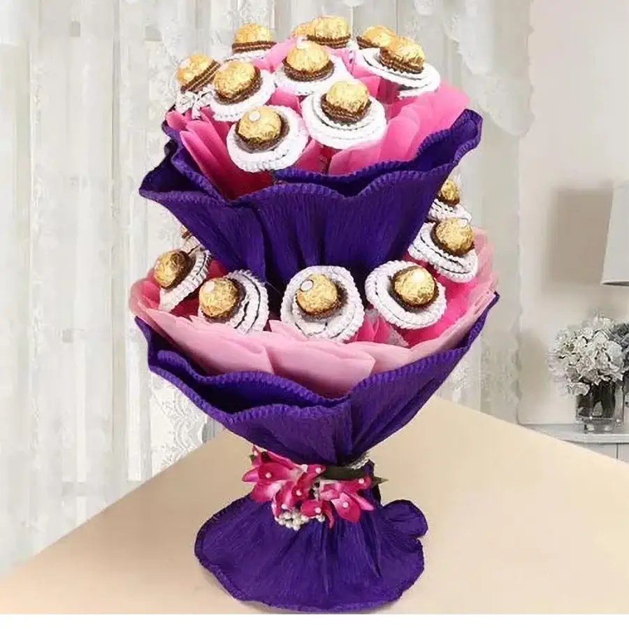 Double deck Ferrero Rocher chocolate bouquet featuring 16 chocolates in two tiers, wrapped in colorful tissue.