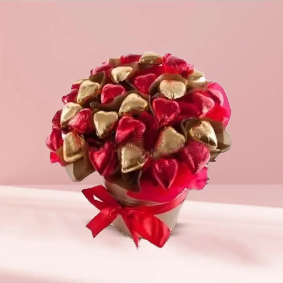 Bucket filled with heart-shaped chocolates in various colors and designs.