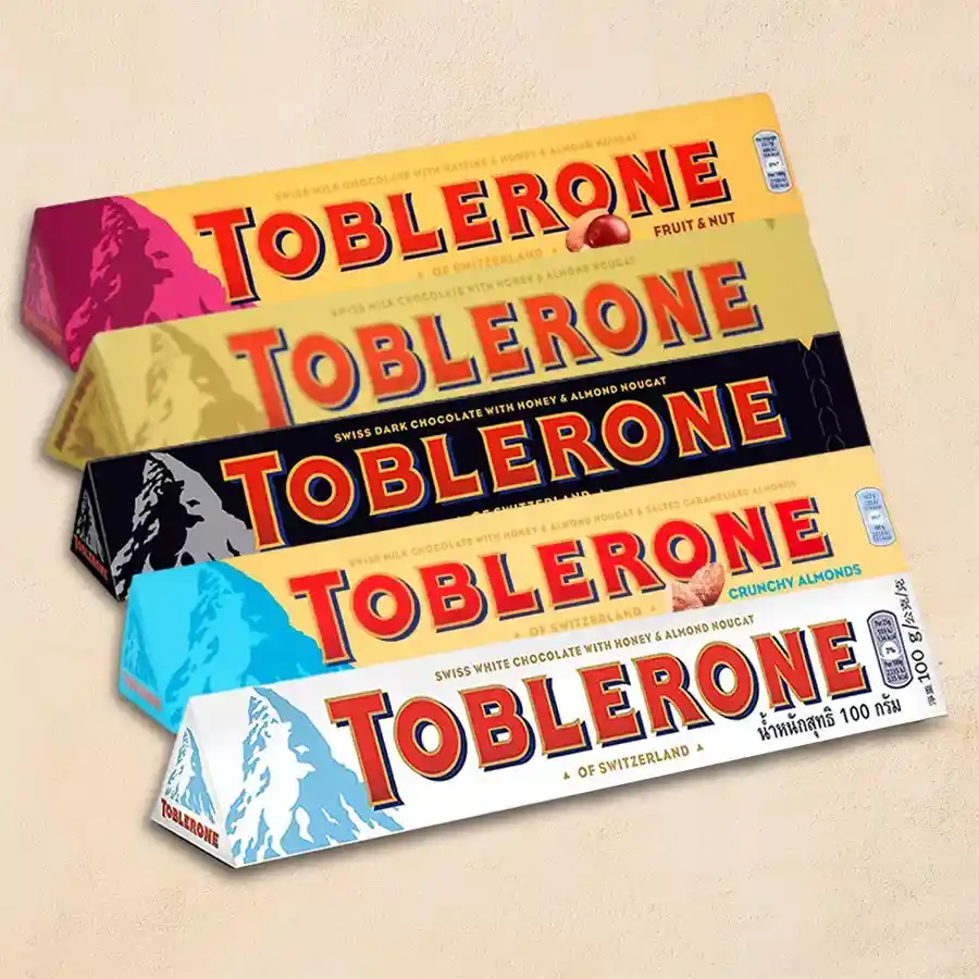 Assorted Toblerone chocolates in a 5-piece gift pack with various flavors and a decorative pouch
