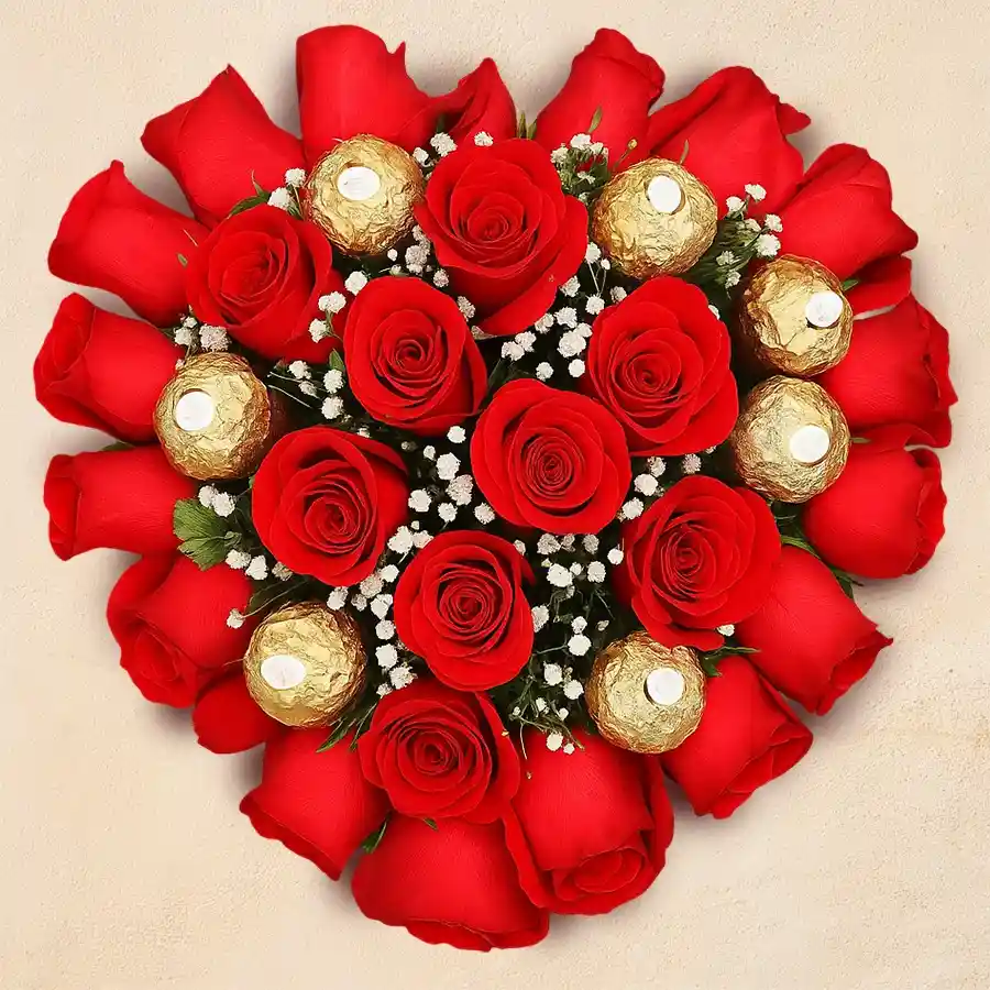 Heart-shaped arrangement featuring 24 red roses and 16 Ferrero Rocher chocolates, ideal for gifting on special occasions.