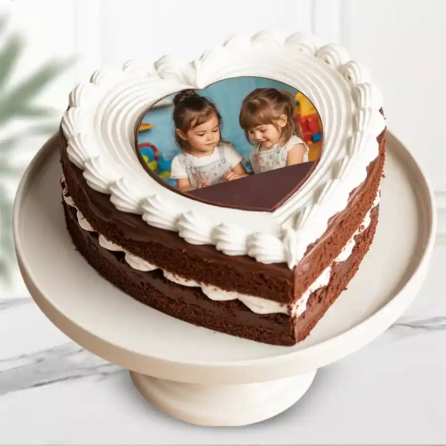 Heart-shaped chocolate photo cake with personalized photo topping and rich chocolate icing.