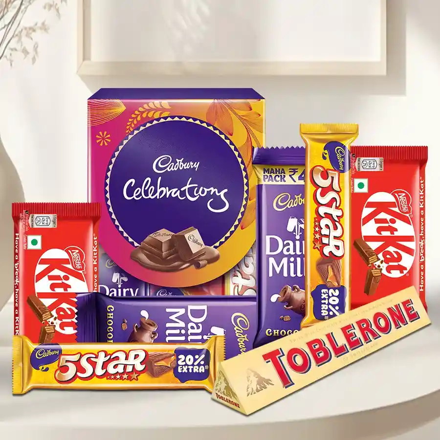 Marvellous Chocolates Gift Hamper featuring Cadbury Celebration, Dairy Milk bars, 5 Star, Nestle KitKat, and Toblerone arranged in a festive presentation.