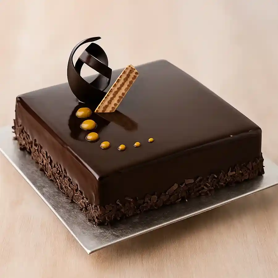 A delectable 1/2 kg Chocos Cake, freshly baked and ready to delight chocolate lovers.