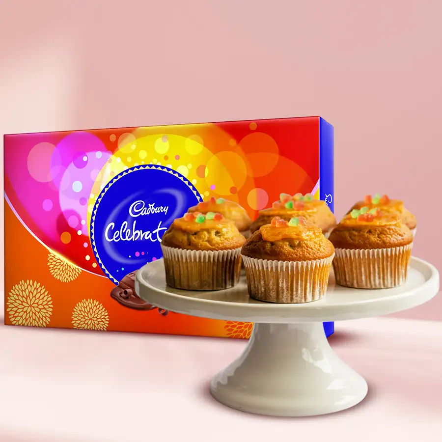 Lavish Tutty Fruity Muffins alongside Cadbury Celebration chocolates in a festive gift set.