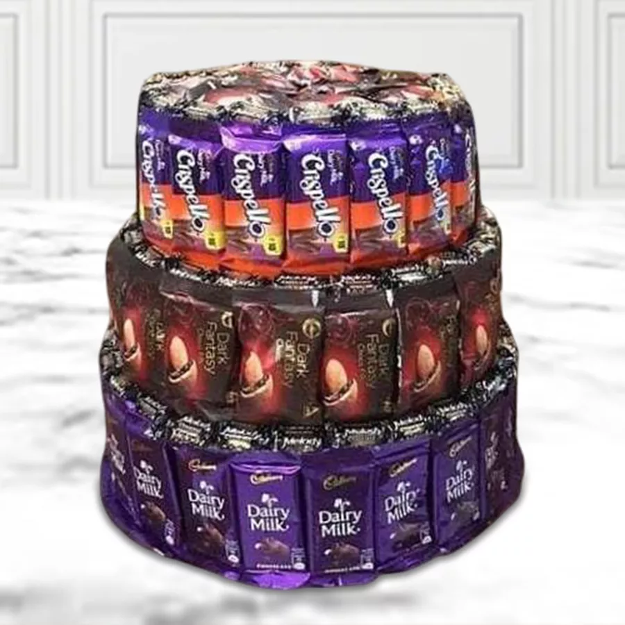 Three-layer arrangement of mixed chocolates and cookies, featuring Cadbury Dairy Milk chocolates, ITC Dark Fantasy cookies, and Cadbury Crispello wafers, beautifully presented as a gift.