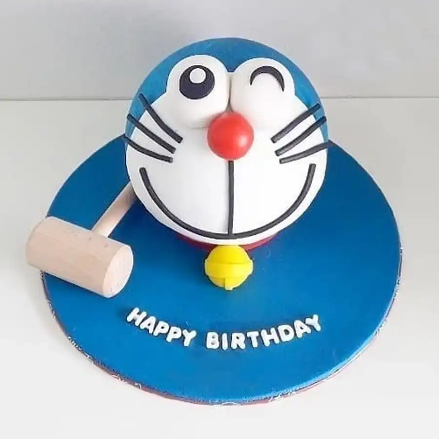 Doremon-themed smash cake with hammer, perfect for celebrations.