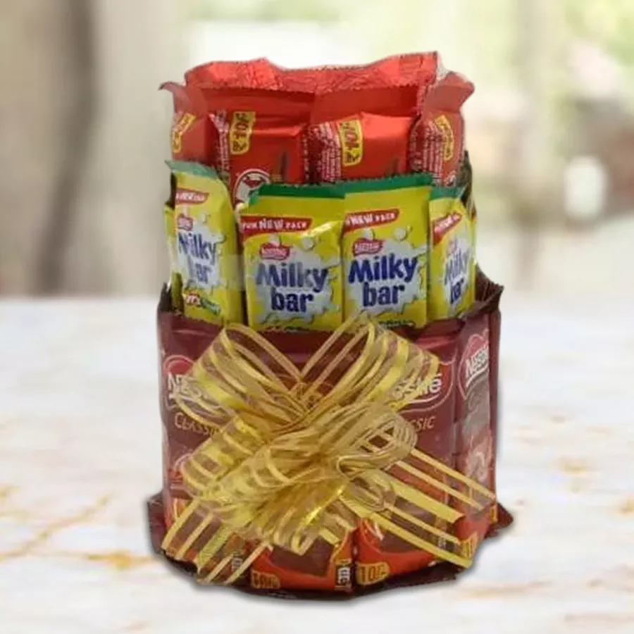 3-layer chocolate tower arrangement featuring Nestle treats including Kit Kats, Milky Bars, and Classic Chocolate Bars
