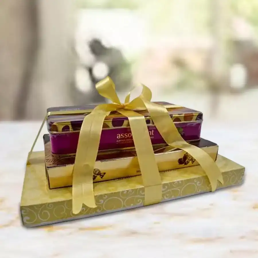 Premium 3-Layer Nutty Chocolaty Tower featuring truffle chocolates, Ferrero Rocher Moments, and almond coated chocolate tin