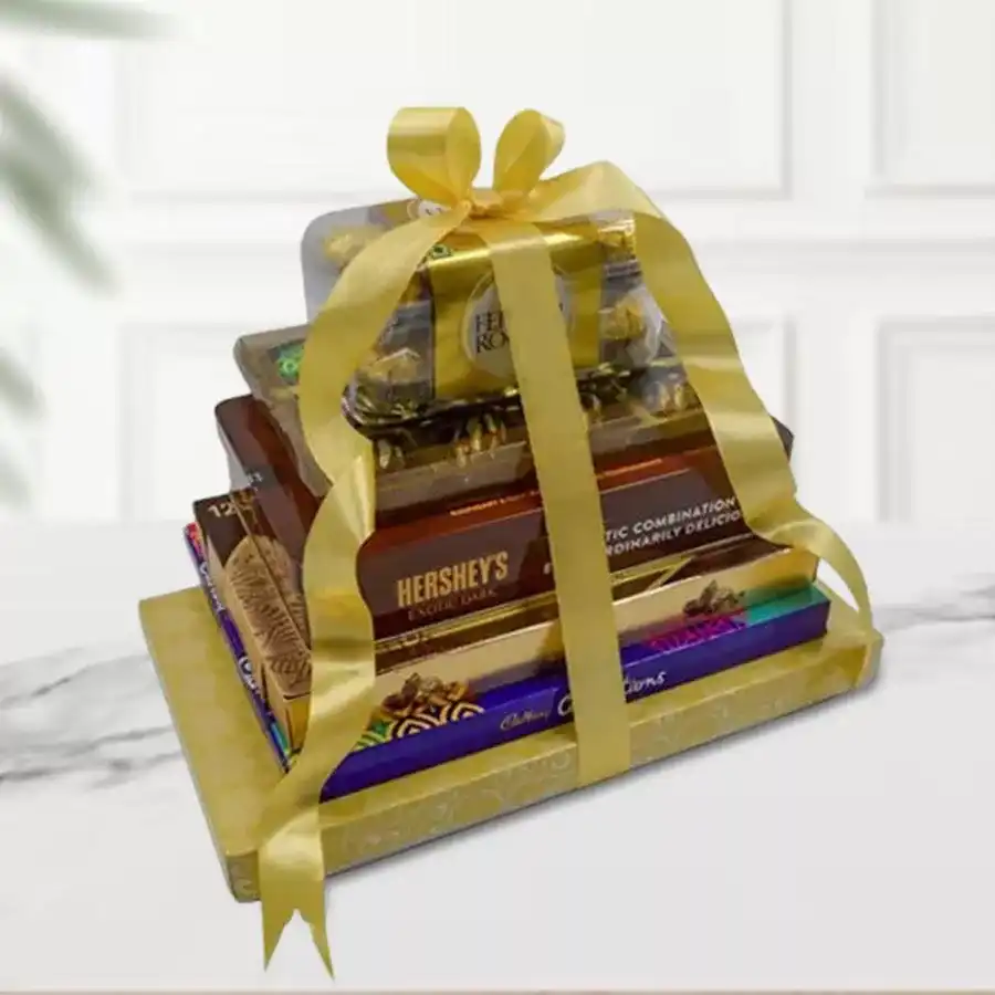 Choco Unbound Chocolate Tower Arrangement featuring Ferrero Rocher, Hershey's Kisses, Cadbury Celebrations, Premium Truffles, and handmade chocolates.