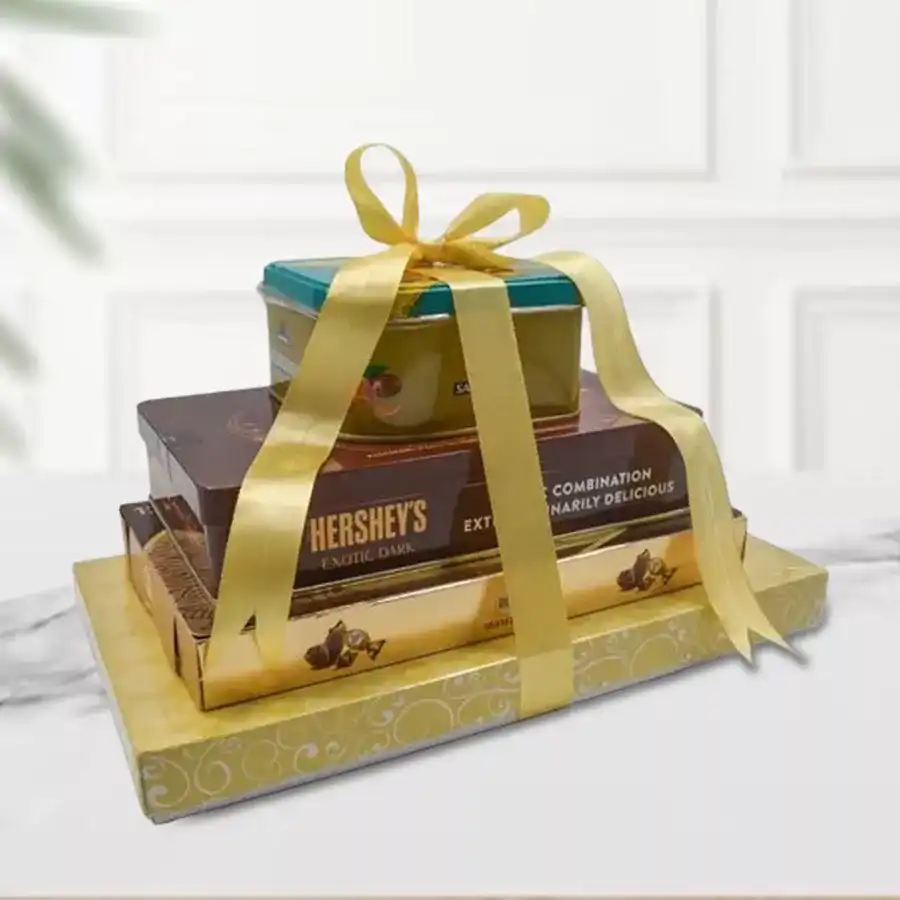 6 Tier Chocolate Tower featuring Ferrero Rocher, Hershey’s Kisses, Cadbury Celebrations, luxurious truffles, handmade chocolates, and almond-coated gems in an elegant display