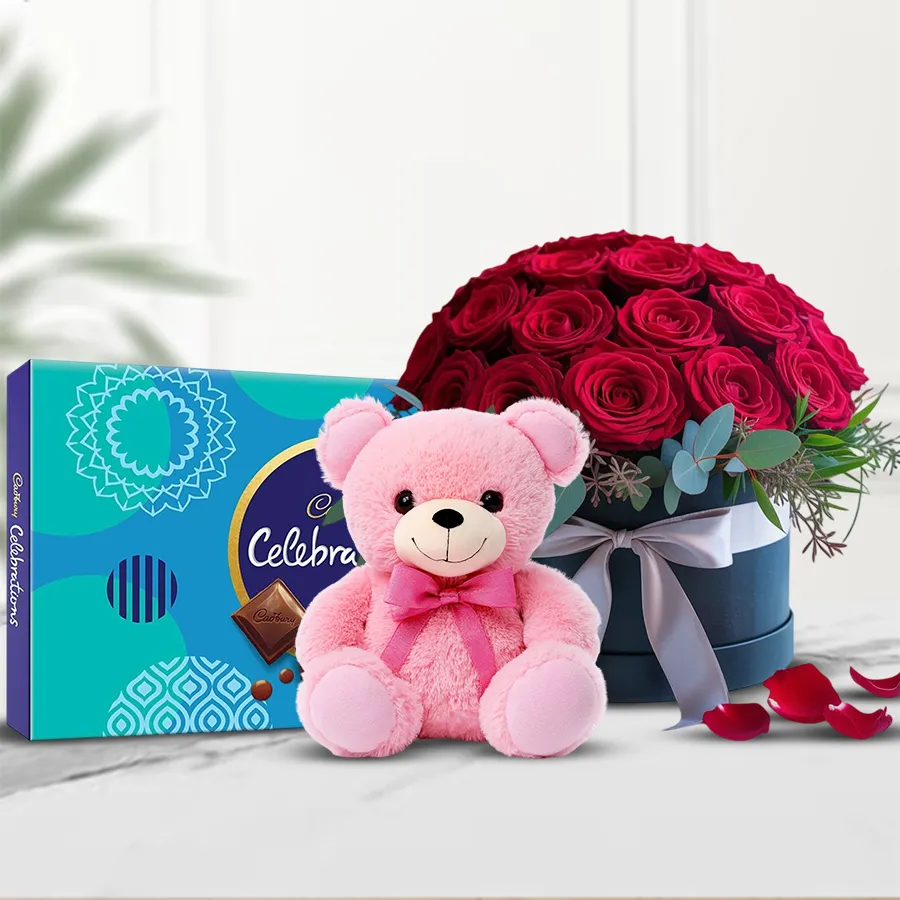 A beautiful bucket of 36 red roses alongside a Cadbury Celebration gift pack and a 6-inch Love Teddy, perfect for Valentine's Day gifting.