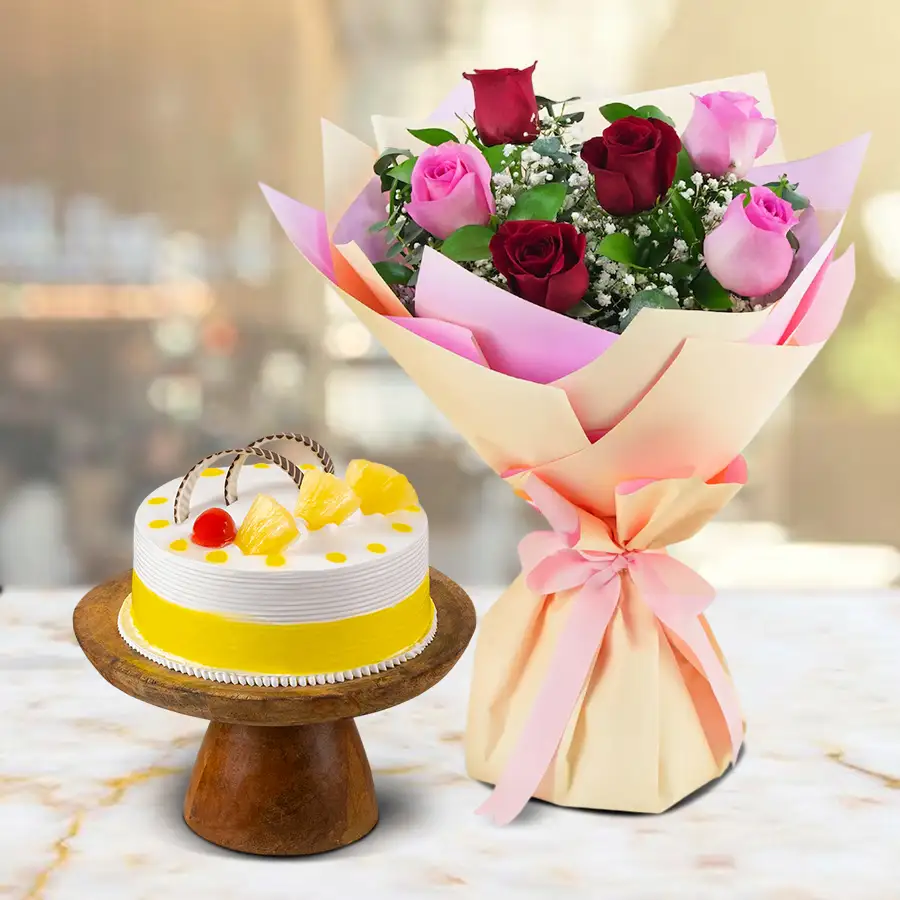 Tropical Bliss Cake with a bouquet of Red and Pink Roses.