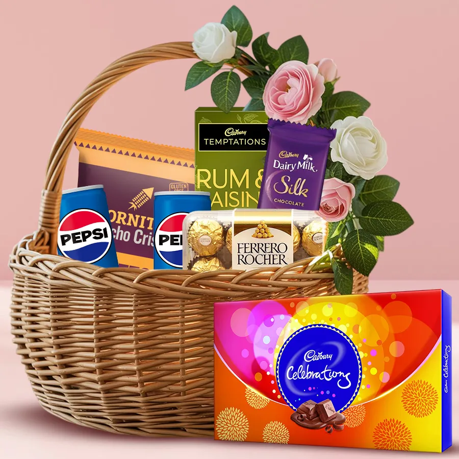 Festive basket filled with nachos, chocolates, and drinks for holiday celebrations.