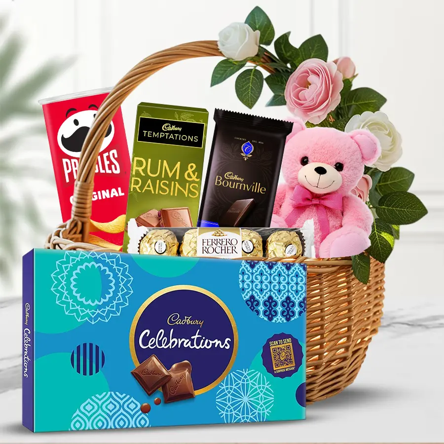 Cheerful Xmas Snack Surprise Basket with chocolates, chips, and a teddy.