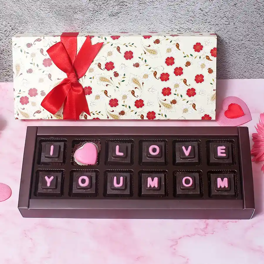 12-piece chocolate gift box labeled "Love You Mom" featuring a variety of handcrafted chocolates in an elegant packaging.