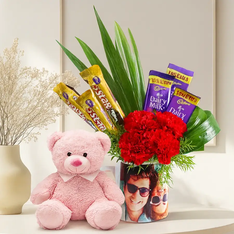 Personalized photo mug gift set with chocolates and teddy bear.