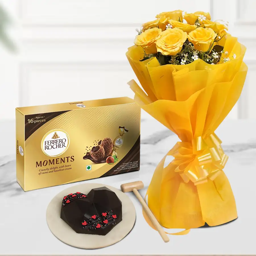 A vibrant bouquet of yellow roses and heart-shaped chocolate pinata cake with Ferrero Rocher chocolates for Valentine's Day.