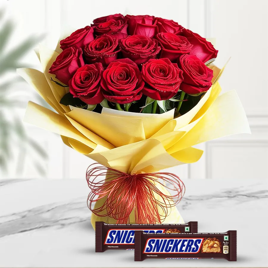 Bouquet of 20 red roses with tissue wrapping and 2 Snickers chocolates.