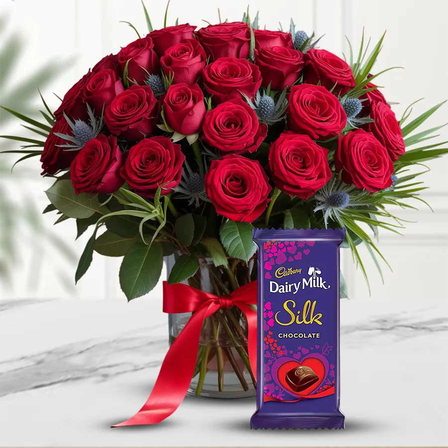 A beautiful vase of 24 red roses paired with a Cadbury Dairy Milk Silk chocolate bar for a romantic gift on Valentine's Day.