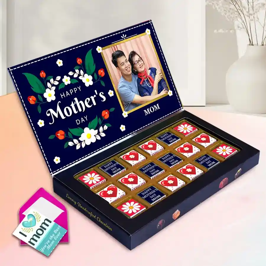 Personalized box of 18 assorted chocolates for Mother's Day featuring flavors like Roasted Dry Fruit, Cranberry, and Butterscotch, decorated with a name and photo, alongside a heartfelt greetings card.