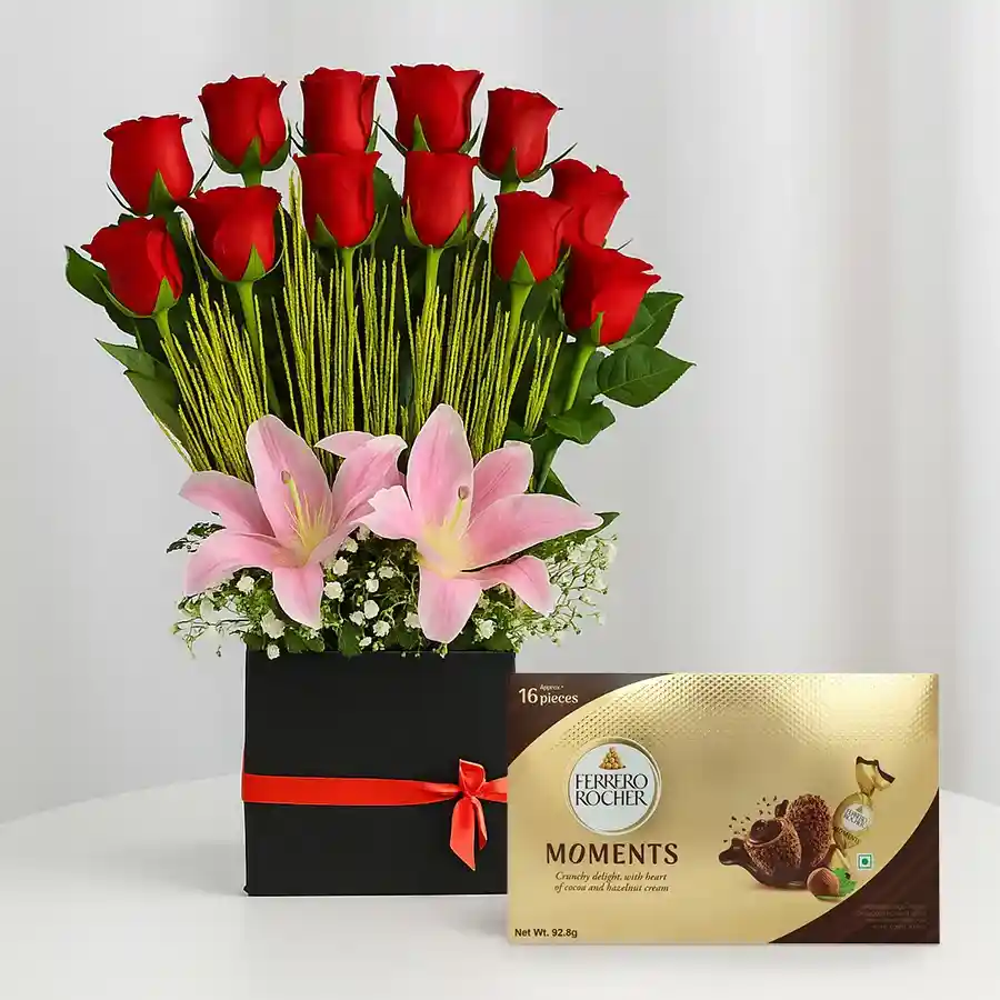 Gift box featuring 12 red roses, 3 pink lilies, and Ferrero Rocher chocolates.