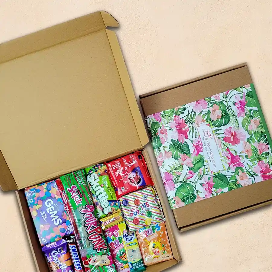 Delectable Choco Treat Gift Box filled with a variety of chocolates and sweets including Cadbury Gems, Crispello, 5 Star, Snickers, Milky Bar, Rola Cola, Skittles, Poppins, Sour Punks, and Magic Pops.