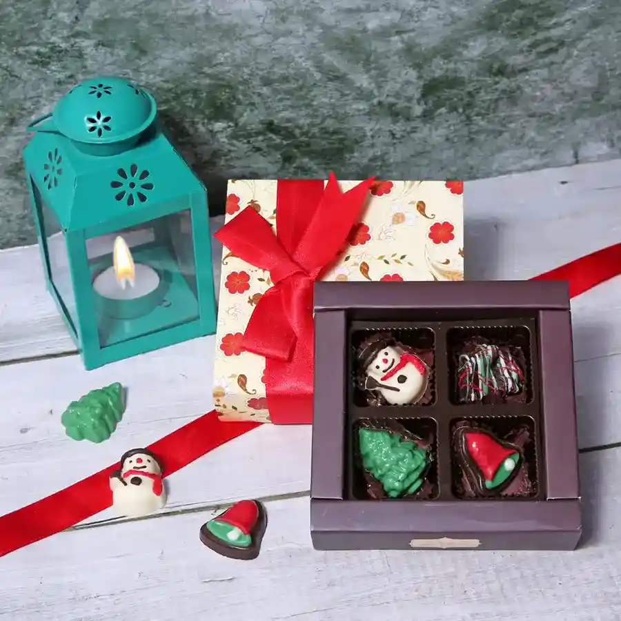 A beautifully designed floral gift box containing four assorted chocolates, perfect for gifting on special occasions.