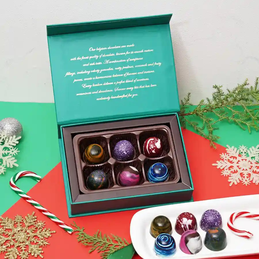 Elegant Bon Bon Collection box with six different chocolate flavors displayed.