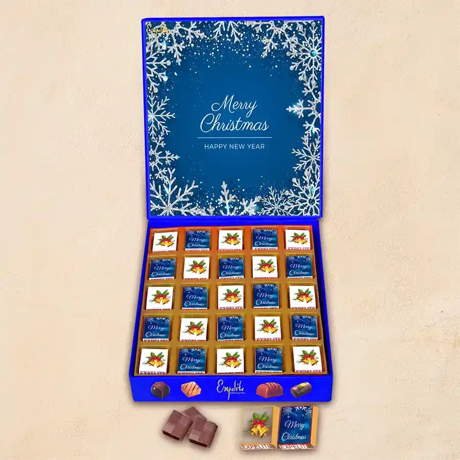 Gift box filled with 25 handcrafted chocolates with various fillings, presented in festive New Year and Christmas-themed packaging.