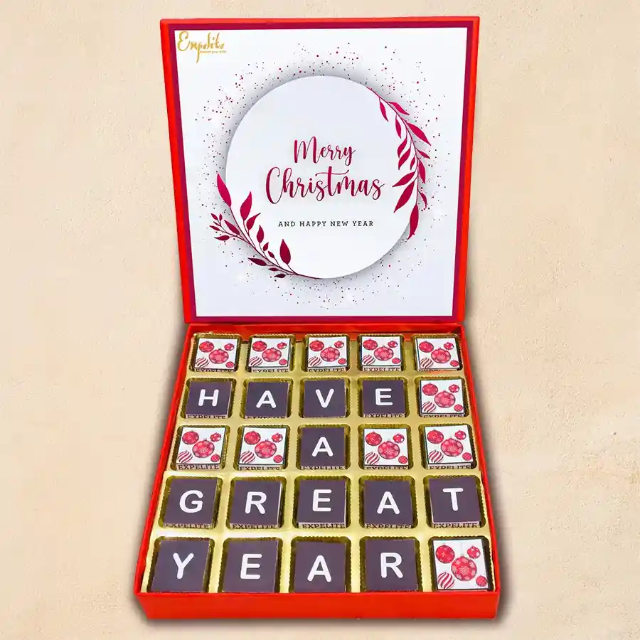 A beautifully arranged box of 25 assorted chocolates with festive designs for Christmas and New Year celebrations.