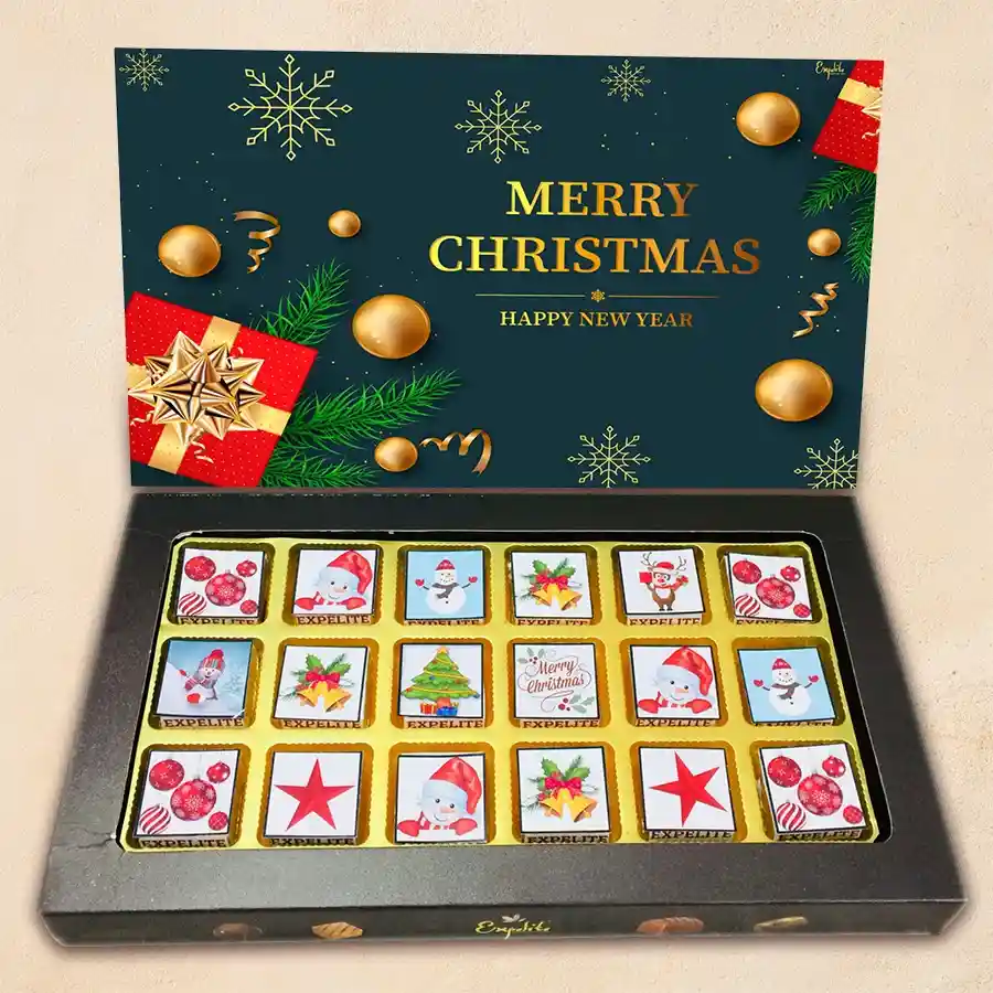Christmas-themed chocolate gift box with assorted flavors including roasted dry fruit, cranberry, paan, butterscotch, mixed fruits, and chocochip.