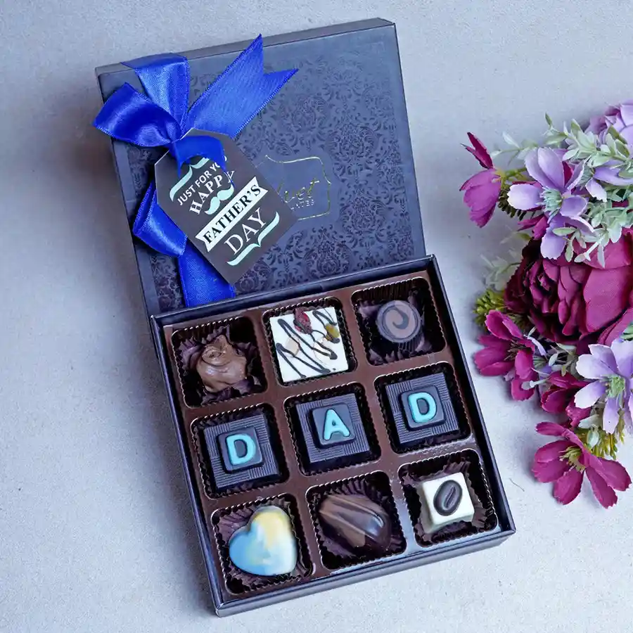 Ultimate Father's Day Mini Chocolate Box featuring assorted chocolates including Almond Rocks, Mix Nut White Chocolate, Hazelnut, Butterscotch, Coffee-filled, Heart Shape White Chocolate, Orange Crisp, Oreo, and Cranberry chocolates.