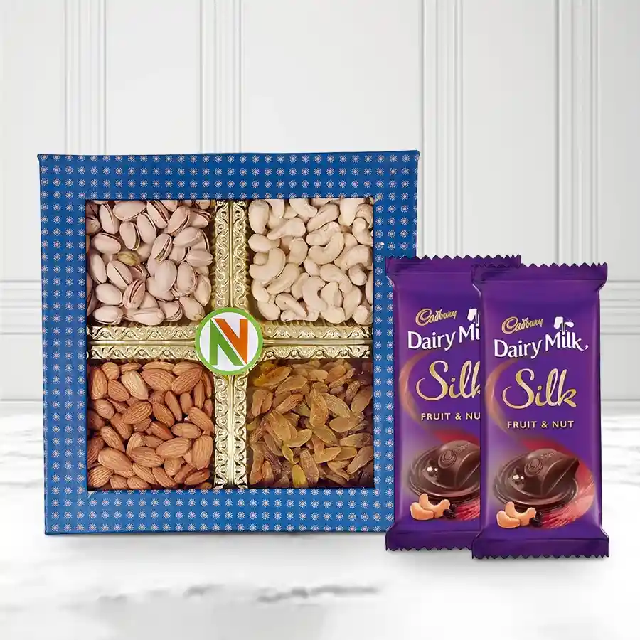 A beautiful gift box containing mixed dry fruits and Cadbury Dairy Milk Silk chocolates, perfect for sharing joy with loved ones.