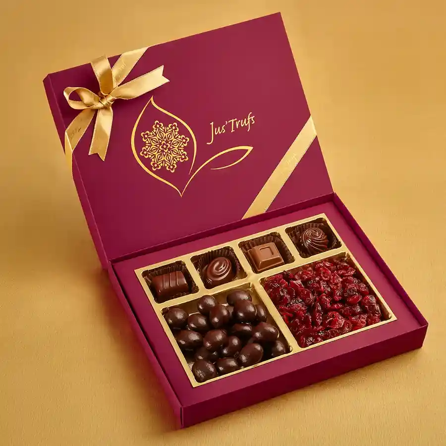Nutty N Fruity Bliss assortment featuring dark chocolate coated almonds, tangy masala cranberries, and classic truffles in a decorative Mandala box