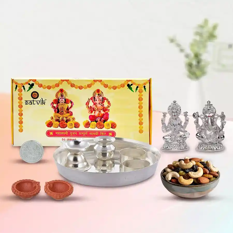 Dry Fruits with Silver Plated Laxmi Puja Hamper Combo featuring Ganesh and Laxmi idols, Puja Samagri Kit, silver Puja Thali, diyas, premium cashews and raisins, and a silver-plated Laxmi Ganesh coin.
