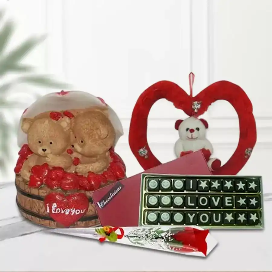 Stunning I Love You Gift Hamper featuring Couple Teddy with Umbrella, homemade alphabet chocolates, cuddly Teddy in heart-shaped soft toy, and artificial red rose