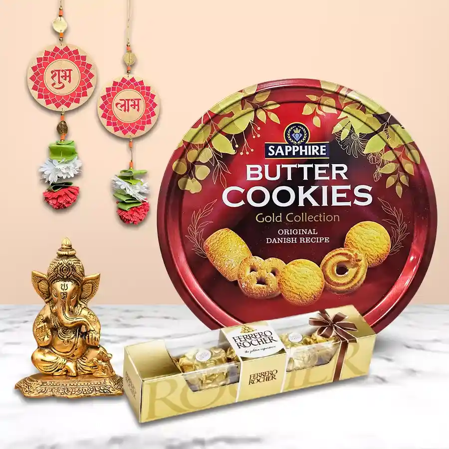 Lip Smacking Delicacy Delight Gift Hamper featuring Sapphire Butter Cookies, Ferrero Rocher chocolates, a Metallic Ganesha, and a Subh Labh Wall Hanging Set.