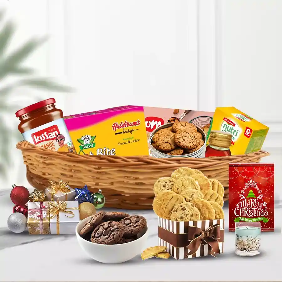 Adorable Christmas hamper filled with biscotti, kookie jars, fruit bakes, honey, jelly candle, card, biscuits, and orange marmalade arranged in a charming cane basket with festive decorations.
