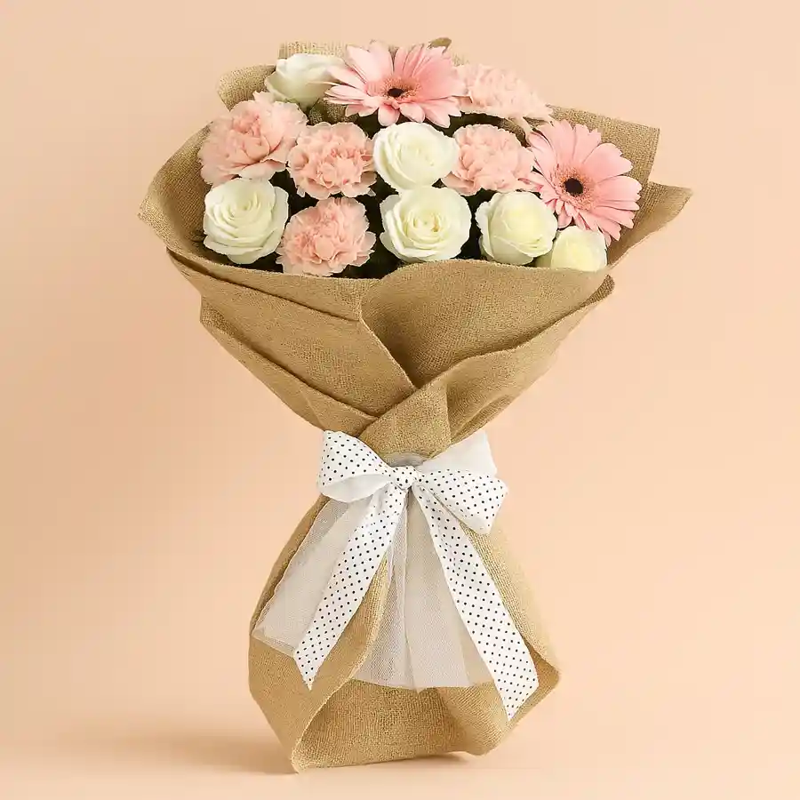 Seasonal Floral Bliss Bouquet featuring roses, gerberas, and carnations, beautifully tied with soft tissue.