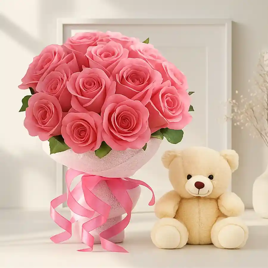 A charming bouquet of 12 pink roses alongside a small teddy bear, ideal for gifting love and affection.
