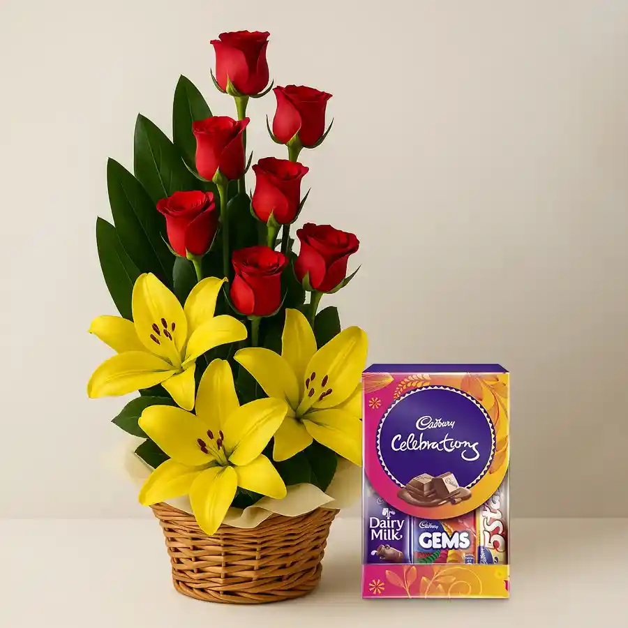 A beautiful arrangement of yellow lilies and red roses with Cadbury Celebration chocolates, symbolizing joy and affection.