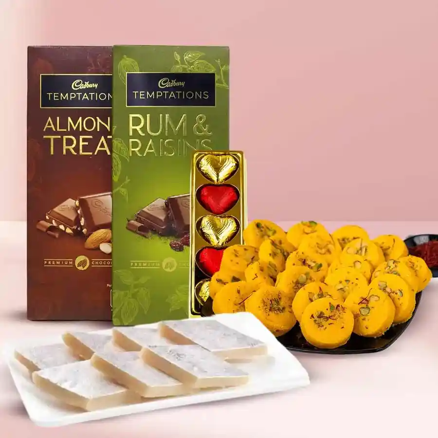 Yummy Festive Celebration Gift Hamper with Kaju Katli, Kesaria Peda, Cadbury Chocolate Bars, and homemade chocolates