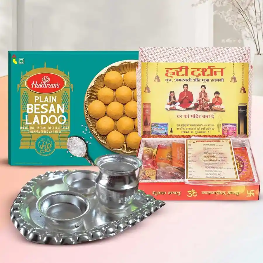 Embellishing the Boon Ganesh Chaturthi Combo featuring Puja Samagri, a paan-shaped Puja Thali, and Haldiram’s Besan Laddoos