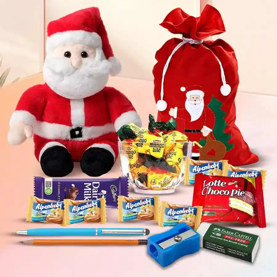 Trendy Looking Goodies Hamper featuring a Santa soft toy, Santa surprise bag, Alpenliebe Candies, Parle Mango Bites, Chocopie, Cadbury Dairy Milk bar, pen, pencil, eraser, and sharpener.