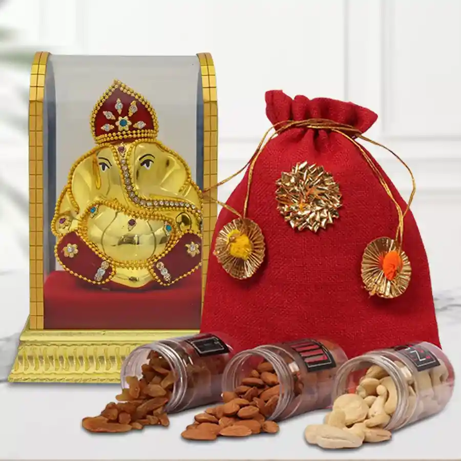 Treasured Mixed Dry Fruits Potli with Vinayaka Murti featuring almonds, cashews, and raisins in an elegant presentation
