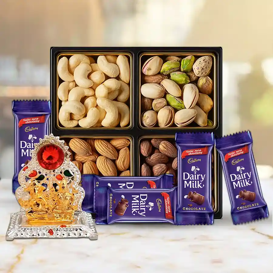 Designer Puja Mandap hamper featuring a Ganesh Mandap, a 200g mix of premium dry fruits, and five Cadbury Dairy Milk chocolates