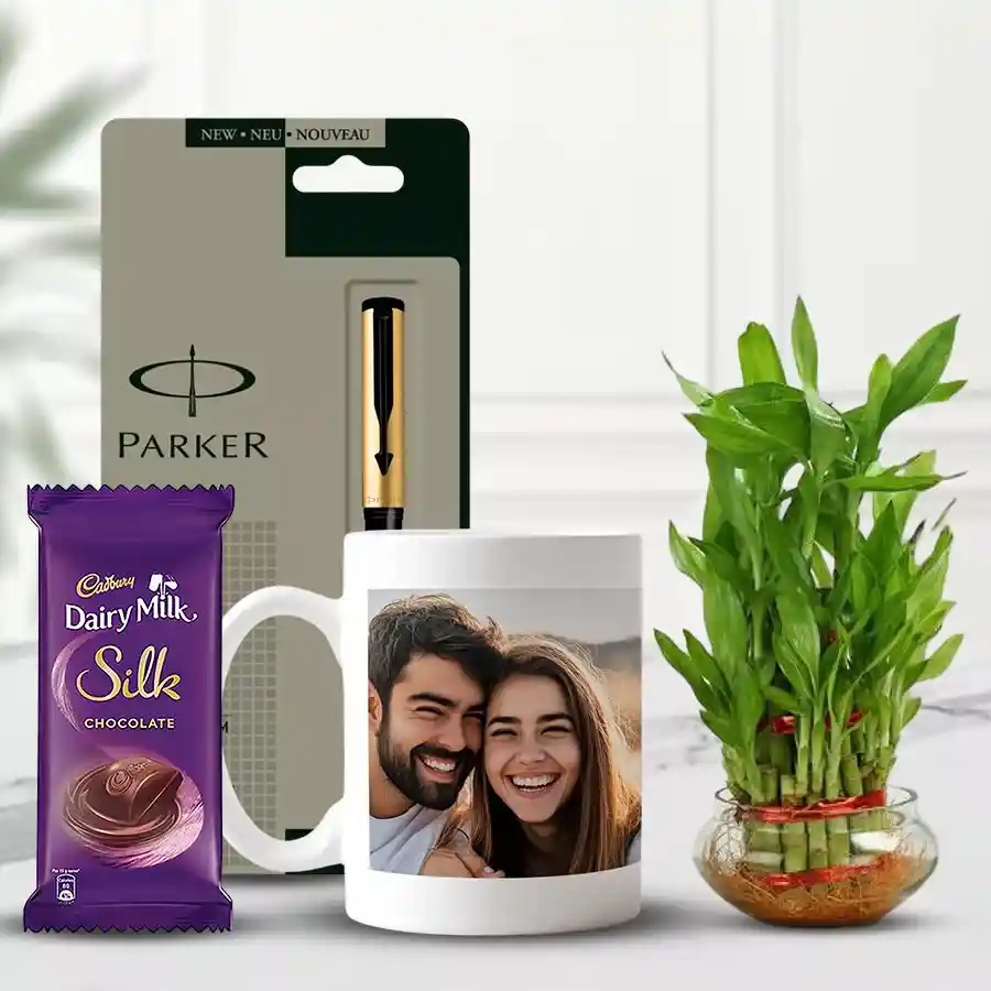 Lucky Bamboo Gift Set featuring a 2-tier Lucky Bamboo plant, personalized coffee mug, Parker Beta pen, and Cadbury Dairy Milk Silk bar, beautifully arranged.
