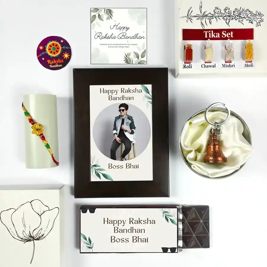 Celebrate Brotherly Love Rakhi Bundle with Rakhi, chocolate bar, photo frame, greeting card, guardian bell, and tika set for Raksha Bandhan.