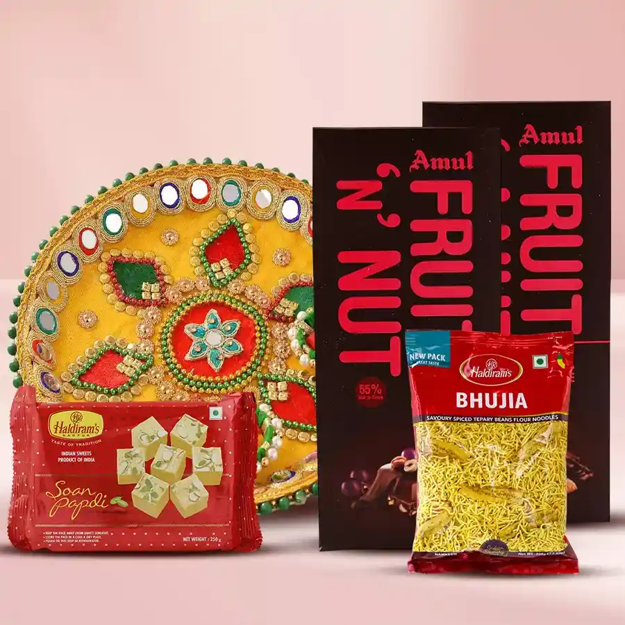 Special Pooja Gift Hamper featuring Amul Fruit & Nut Bars, a Pooja Thali, Haldirams Soan Papdi, and Bhujia